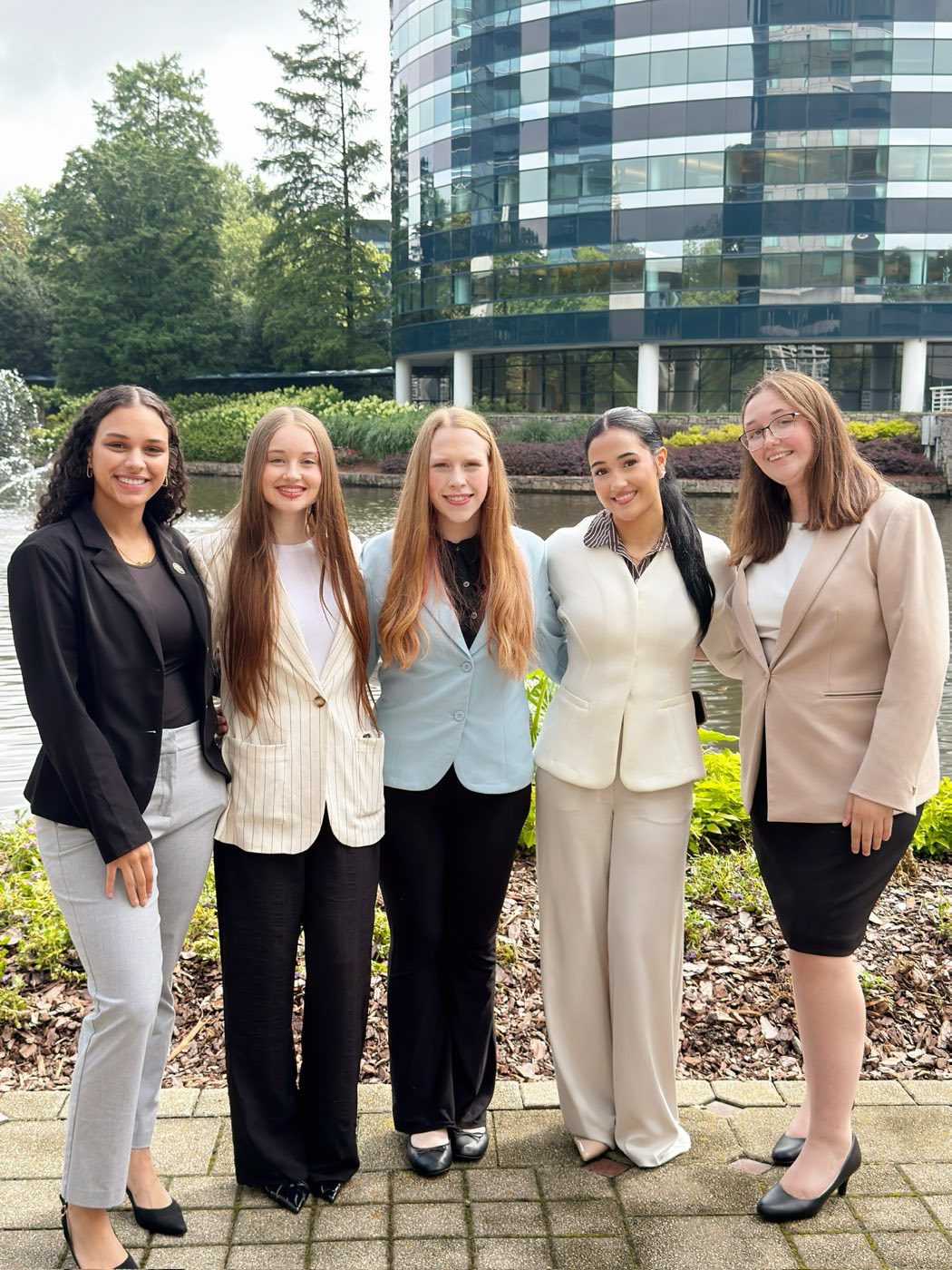 Luxuriate Management team members together outside the office in Charlotte, NC